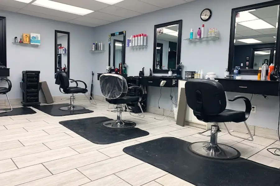 Salon floor at Neville's with styling chairs, mirrors and product shelves